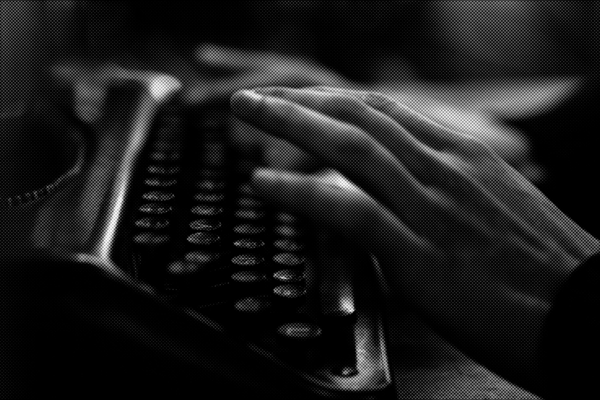 A dark, distorted, halftone image of a person typing on a typewriter from a side angle.